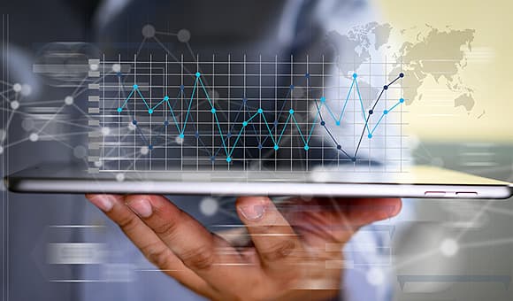 business person viewing spendchec results on tablet